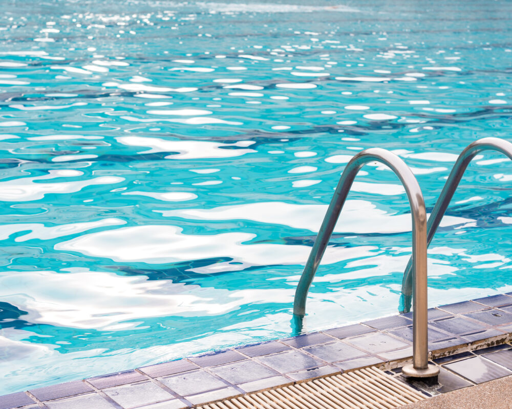 Grab bar ladder at the edge of a swimming pool