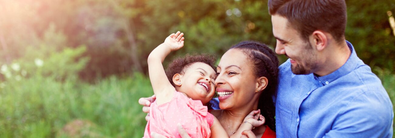 Multiracial family enjoying time together outside