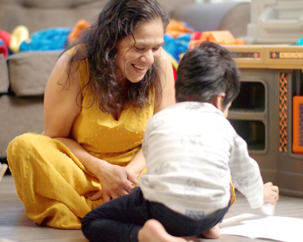 Maggie plays with her son for video on reaching unhoused families