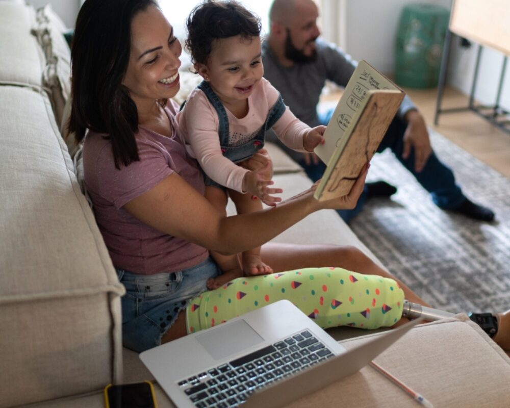 Family engages in virtual home visiting session in living room